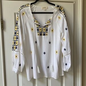 Luna Moon Long  sleeve pullover top. Yellow and blue embroidery on a white top.